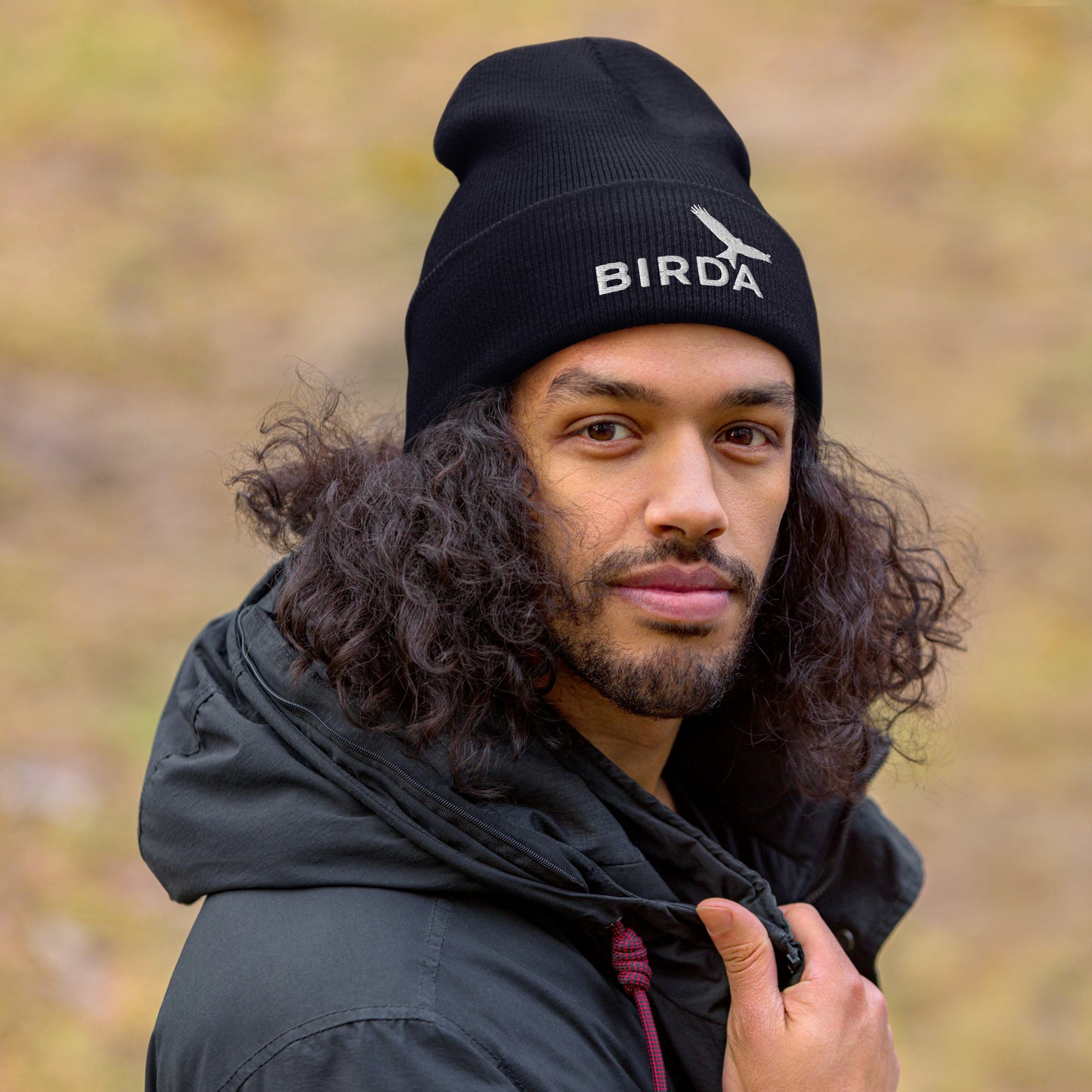 cuffed Bird beanie navy on a man